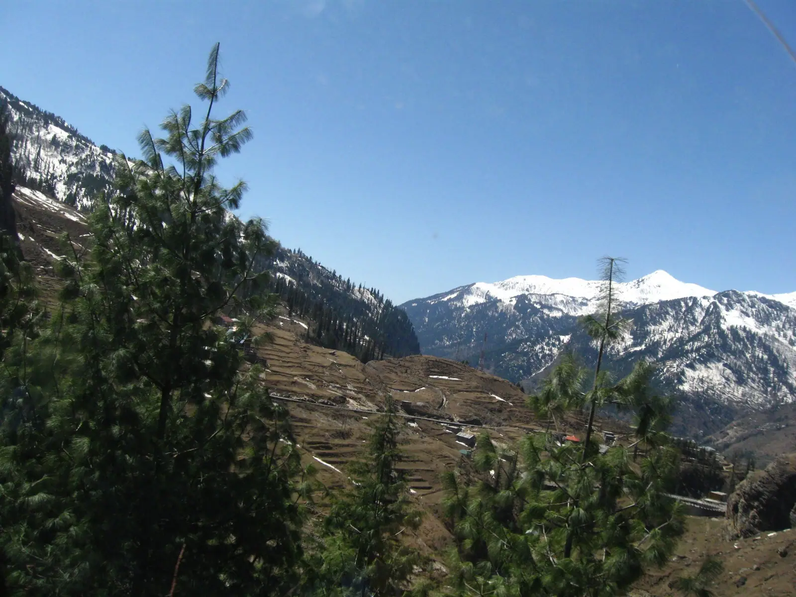 The green bowl of Solang Valley below snow-streaked ridges near Manali, Himachal Pradesh