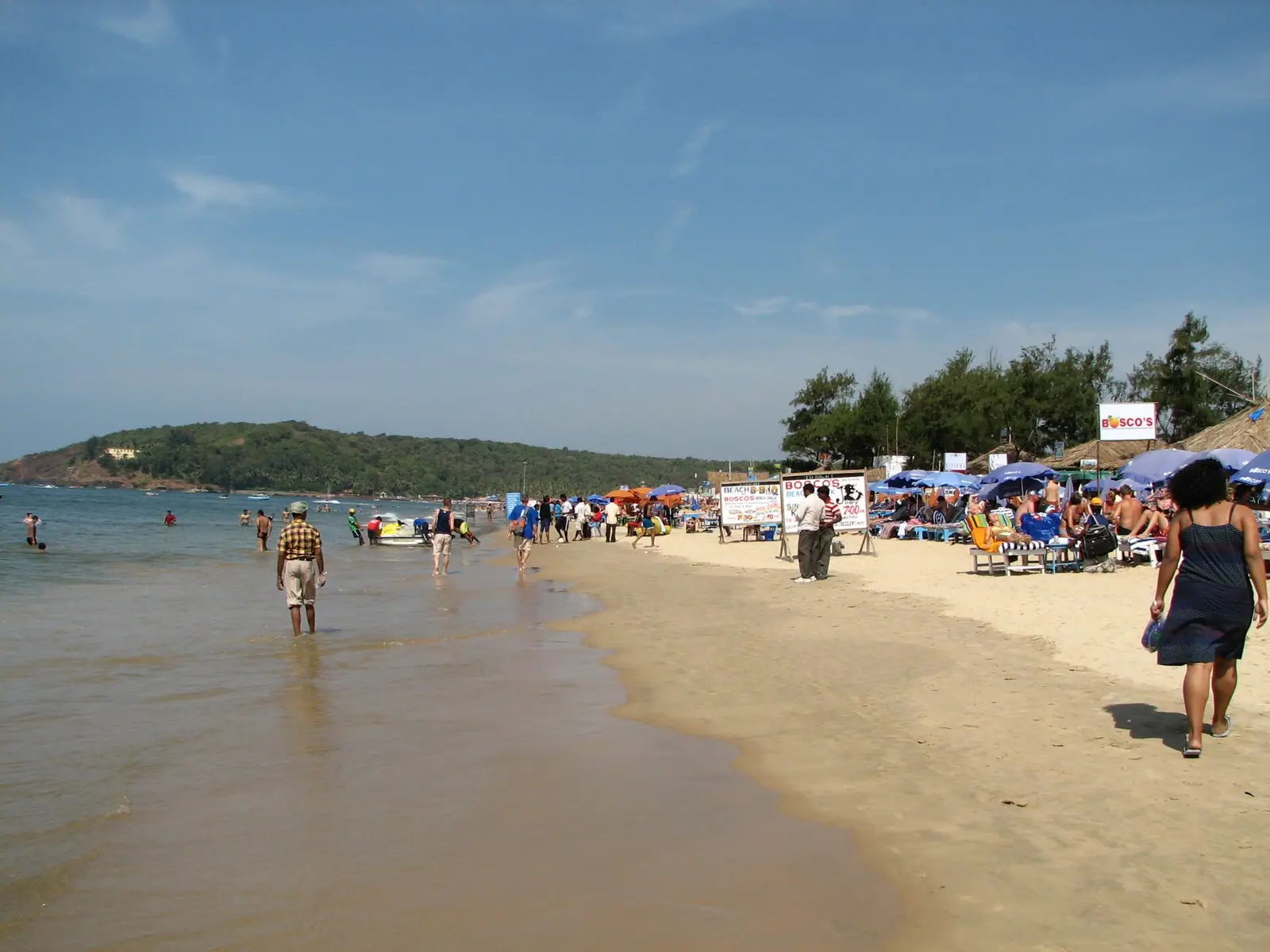 Surf running up the wide sand of Baga beach in North Goa