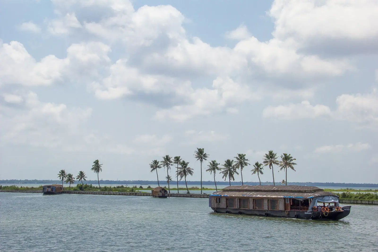 A thatched kettuvallam houseboat on the Alappuzha backwaters in Kerala