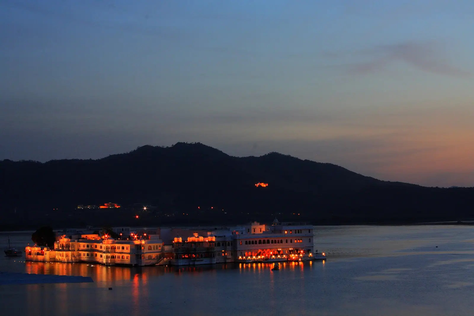 The Lake Palace lit up on Lake Pichola after sunset, Udaipur, Rajasthan