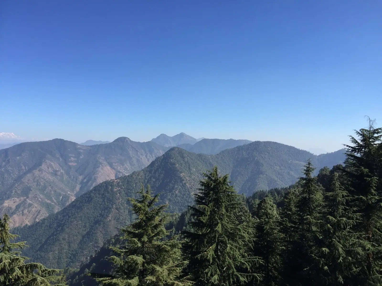 Forested Himalayan ridges and river valleys in Uttarakhand